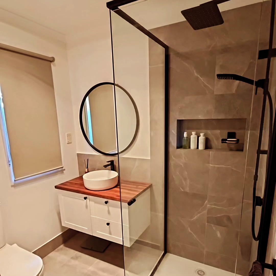 Modern bathroom renovation completed by DMH Construction Co.